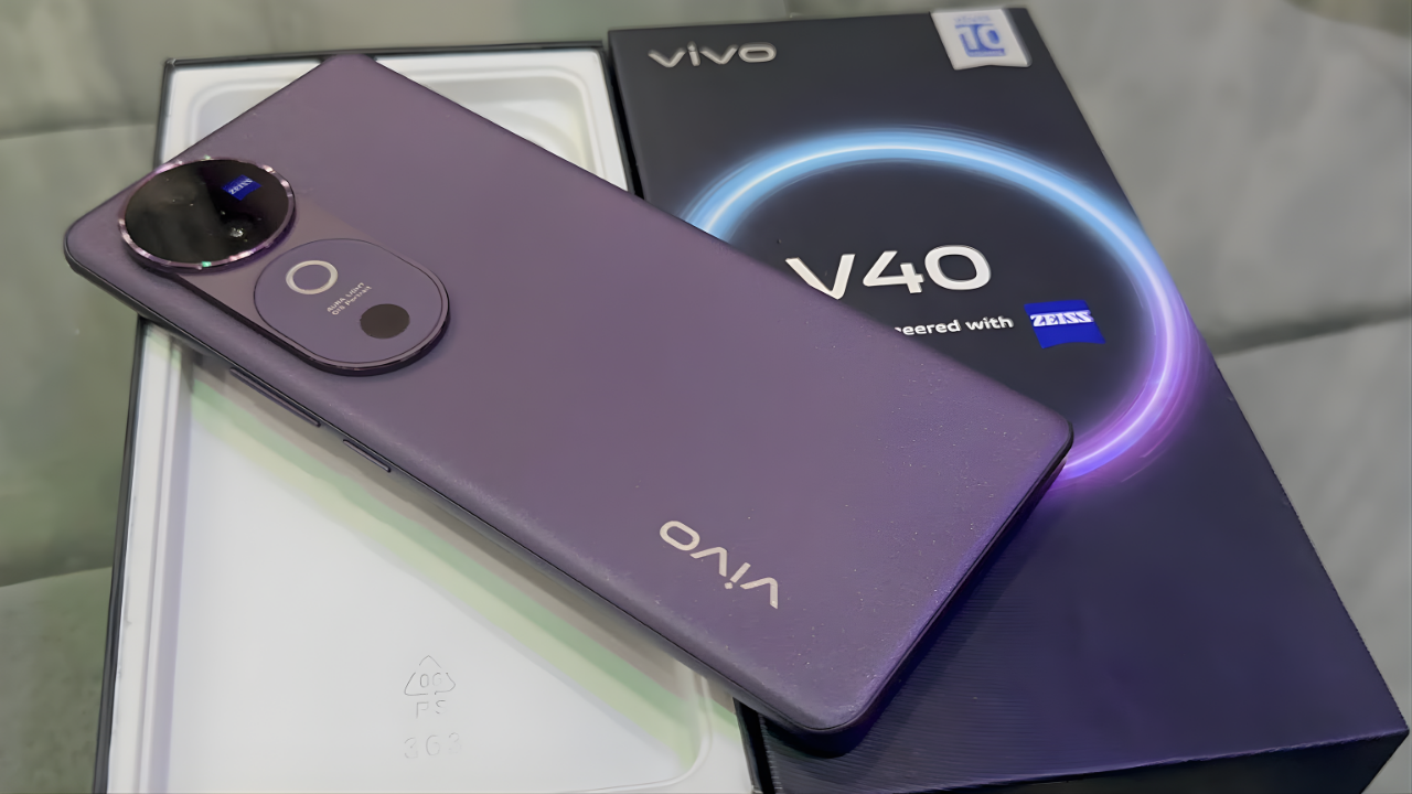 Experience premium features without premium pricing with the Vivo V40 5G - 50MP dual camera with ZEISS optics, curved 120Hz AMOLED display, Snapdragon 7 Gen 3 performance, 5500 mAh battery & 5G support. Read our full 2025 review!